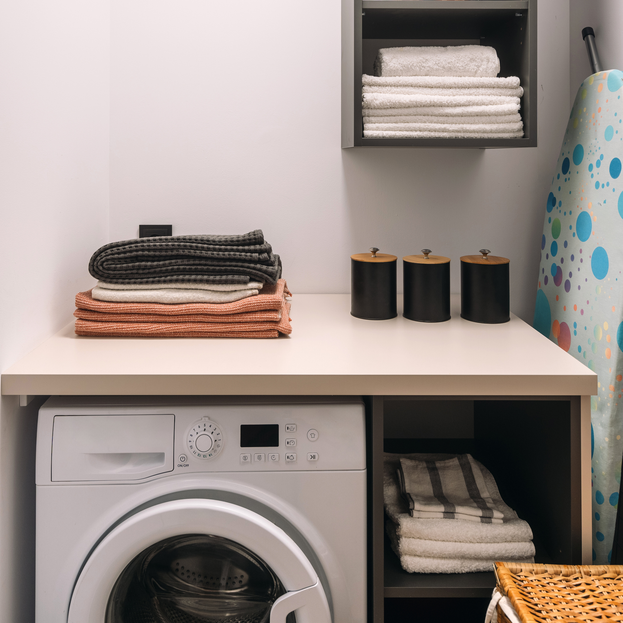 small utility room with ironing board tucked away GettyImages-2194274387
