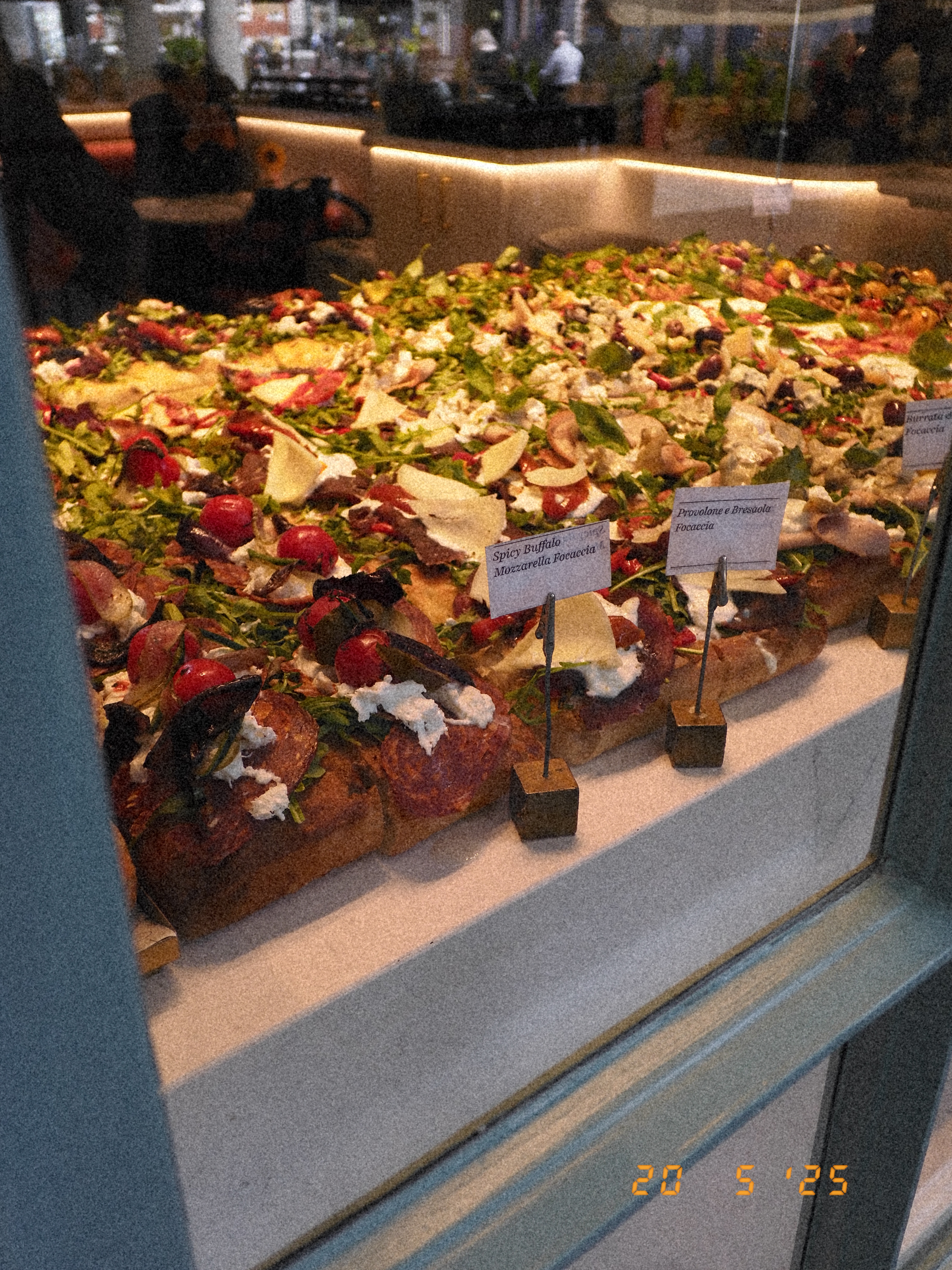 Pizza and other italian food in a store window