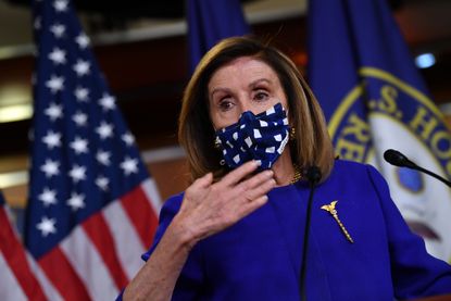 Nancy Pelosi speaks to the press