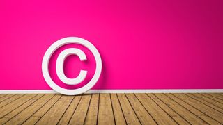 A copyright symbol against a pink background