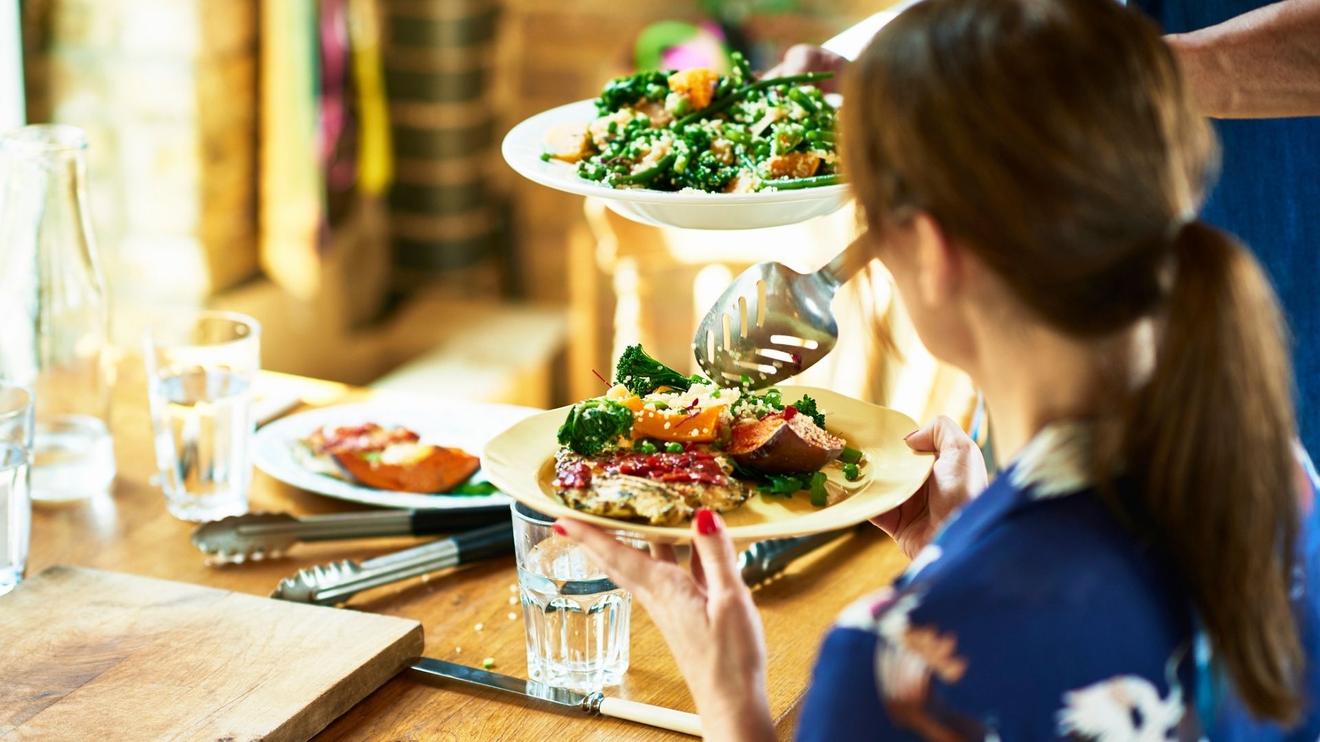 woman being served a healthy meal