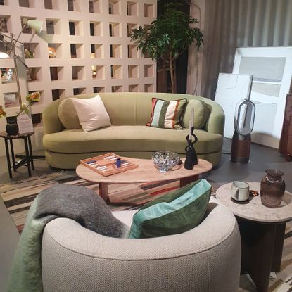 A living room set-up at the John Lewis spring/summer 2025 press showcase with a curved pistachio green sofa