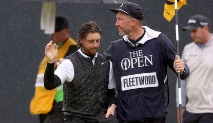 Tommy Fleetwood is consoled by his caddie