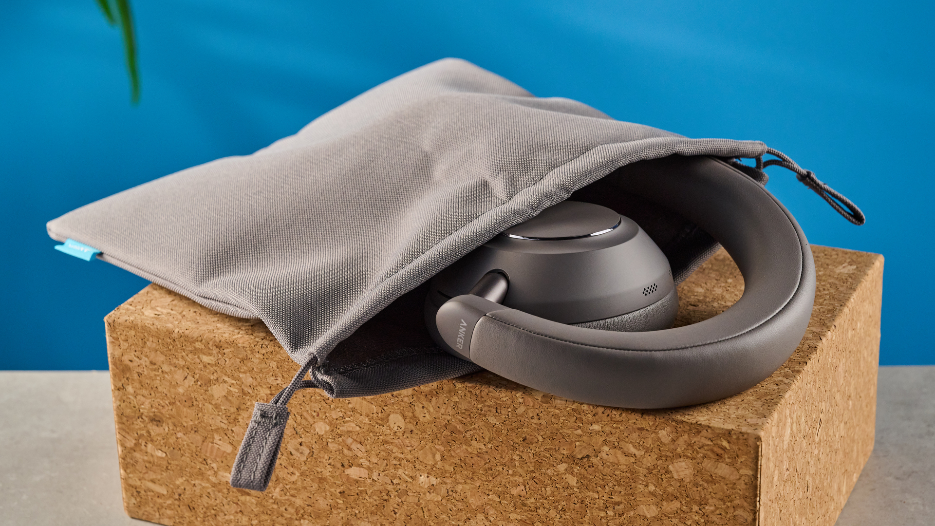 the anker soundcore space 2 pro headphones in mauve gray photographed against a blue tom's guide background