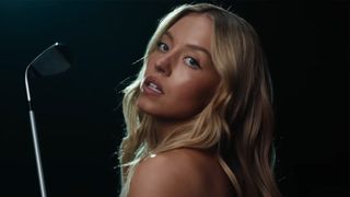 Sydney Sweeney holds a golf club in viral Novig ad 2026. 