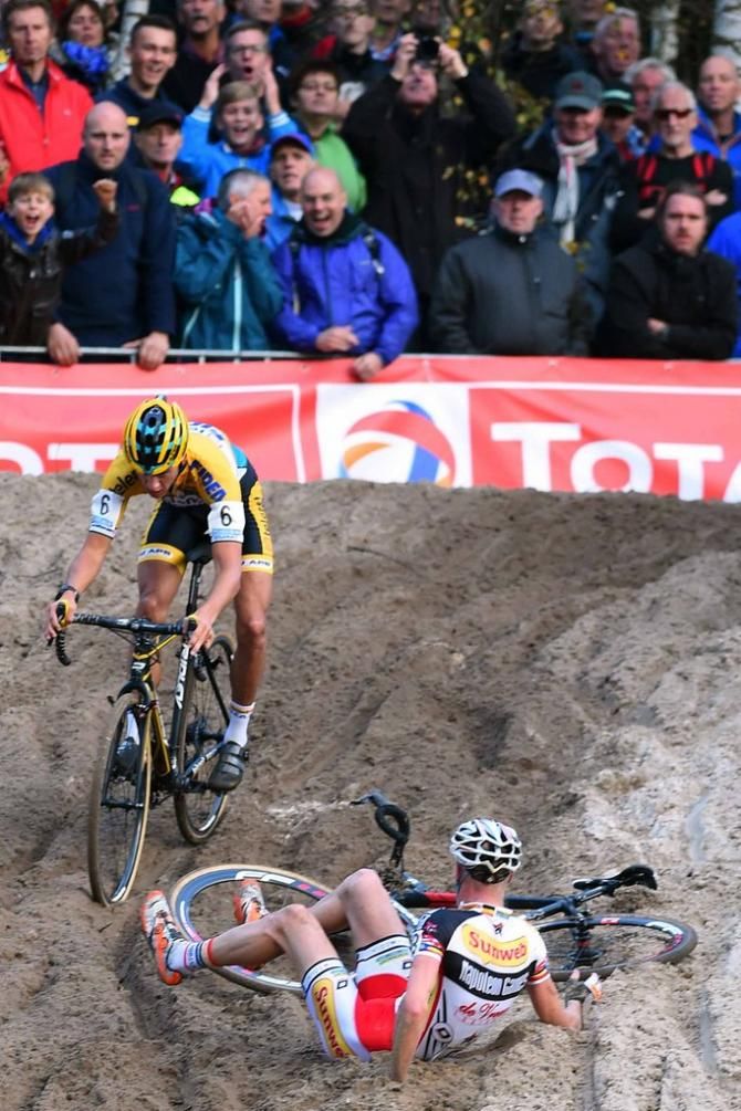 Klaas Vantornout (Sunweb - Napoleon Games Cycling Team) crashes as Tom Meeusen (Telenet Fidea Cycling Team) rides past