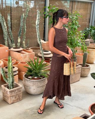 Influencer wearing a brown skirt.