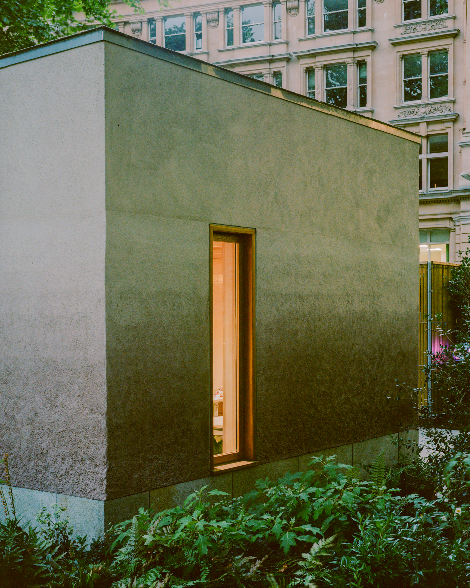 view of Finsbury Circus Parks Office, a minimalist, earthy building set among leafy garden