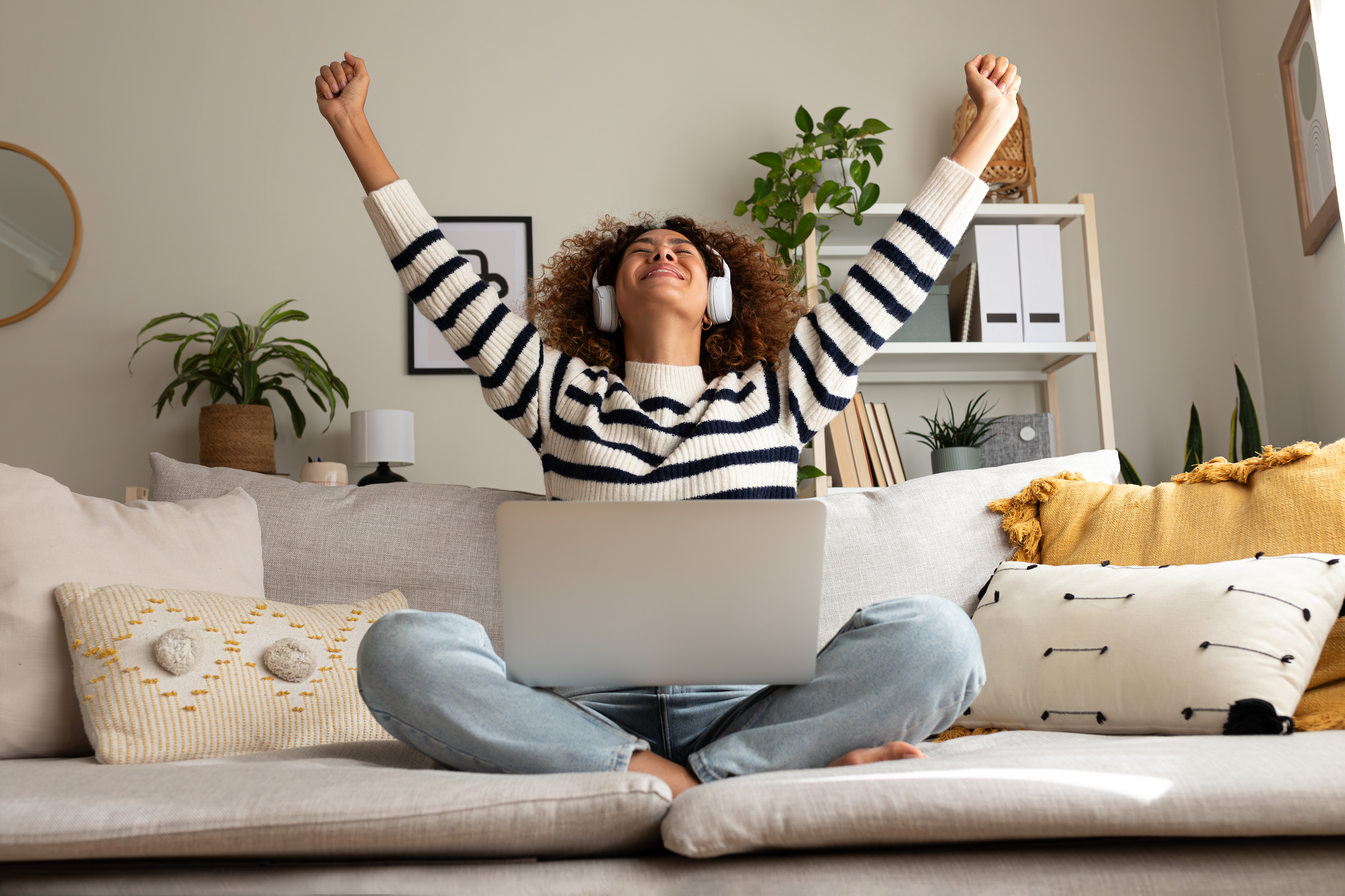 Woman celebrating, pumping her fists into the air