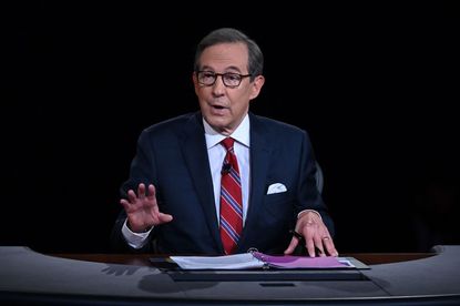 Debate moderator and Fox News anchor Chris Wallace directs the first presidential debate at Case Western Reserve University and Cleveland Clinic in Cleveland, Ohio, on September 29, 2020.