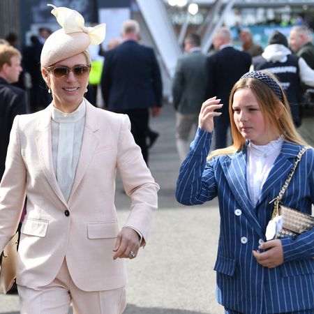Zara and Mia Tindall walking next to each other in trouser suits