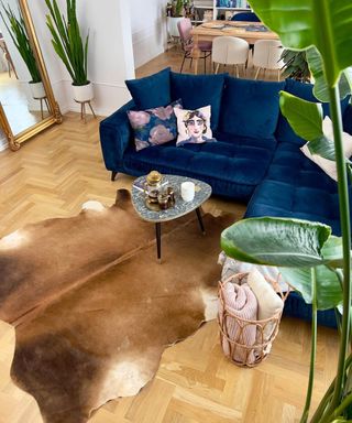 IKEA KOLDBY cowhide rug in apartment with blue velvet sofa