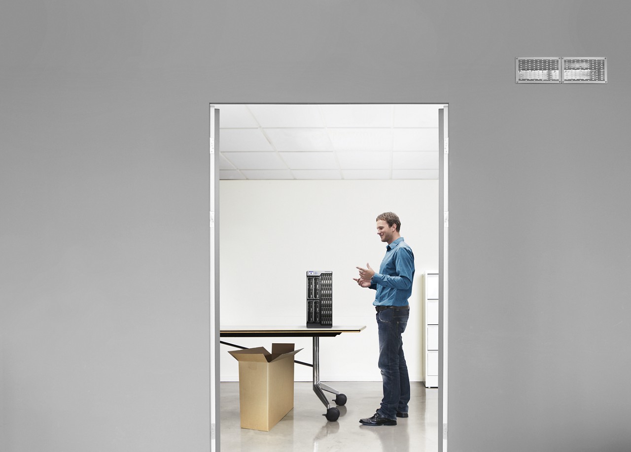 IT engineer admires unboxed Dell server