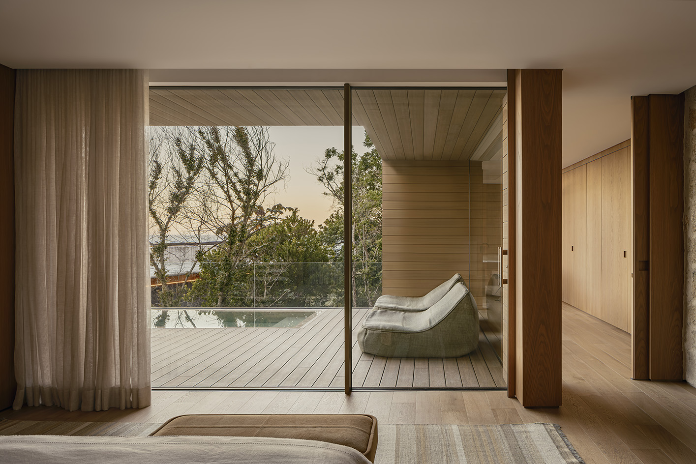 Bravissima House by Arthur Casas, a brazilian house nestled among the forest canopy and rising above the foliage to long views from large windows and ample terraces