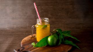 Mango cooler with lime in glass