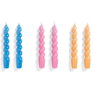 A set of 6 spiral candles in blue, pink, and orange