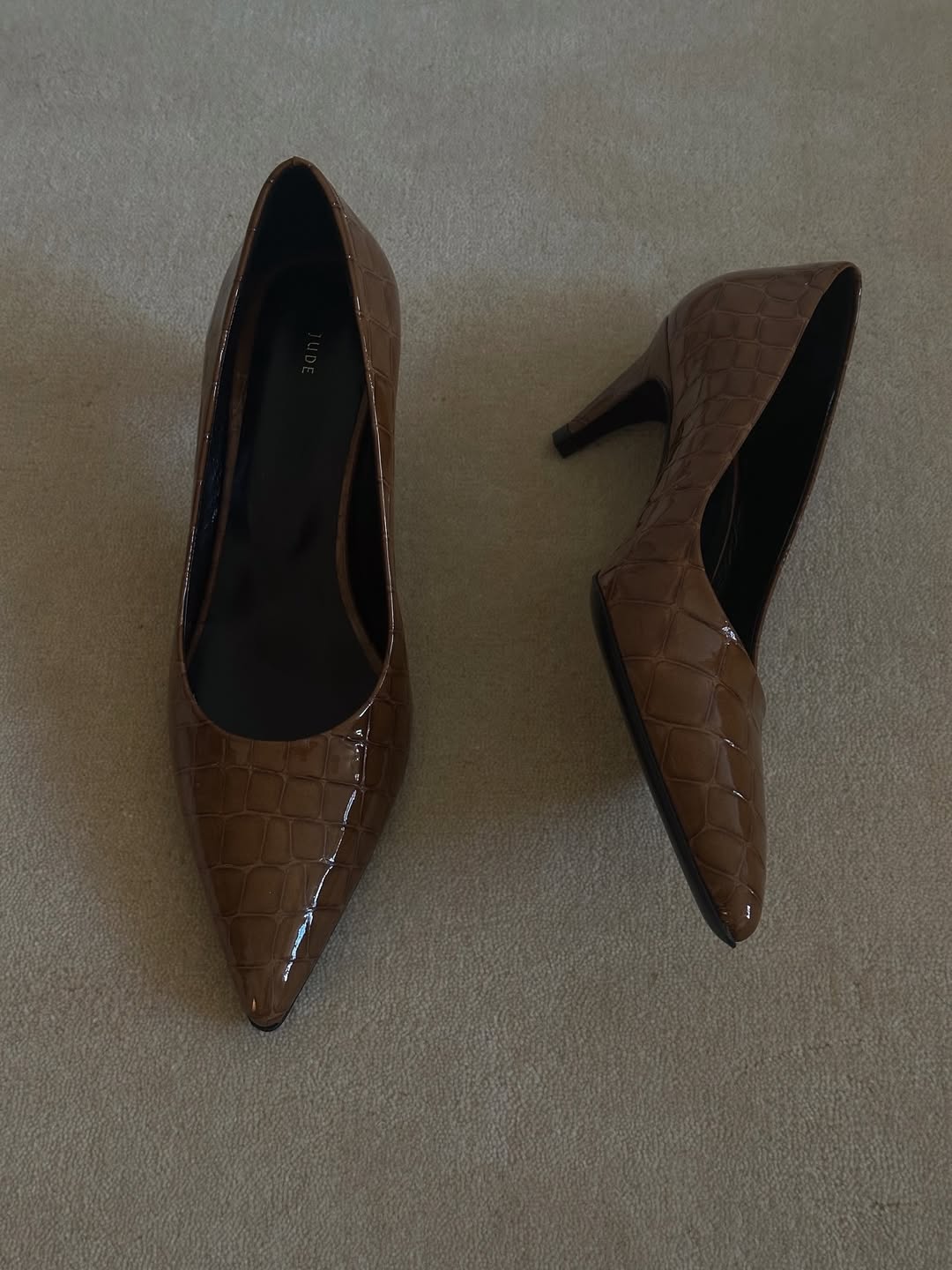 a pair of brown Jude patent-leather croc-embossed pumps