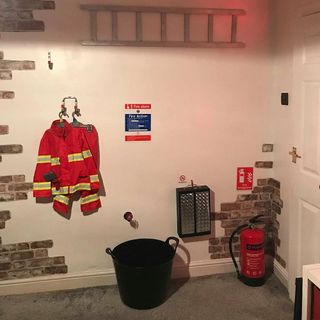 room with fire proof jacket lader and fire extinguisher