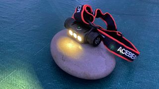 AceBeam H50 2.0 Headlamp on rock