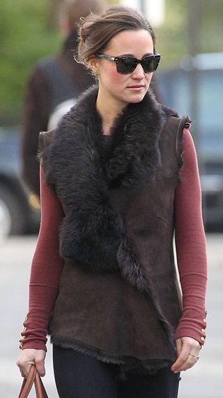 Pippa Middleton walks in London wearing a fluffy gilet in January 2012