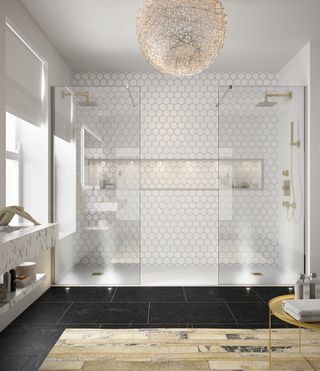 His and hers shower wetroom with hexagonal tiles and black floor