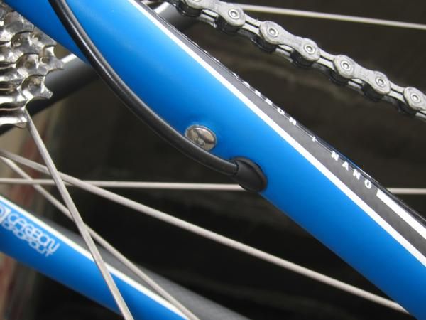 The rear derailleur wires exits the chain stay just ahead of the dropout