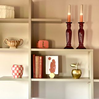 wall shelf with candlesticks and accessories