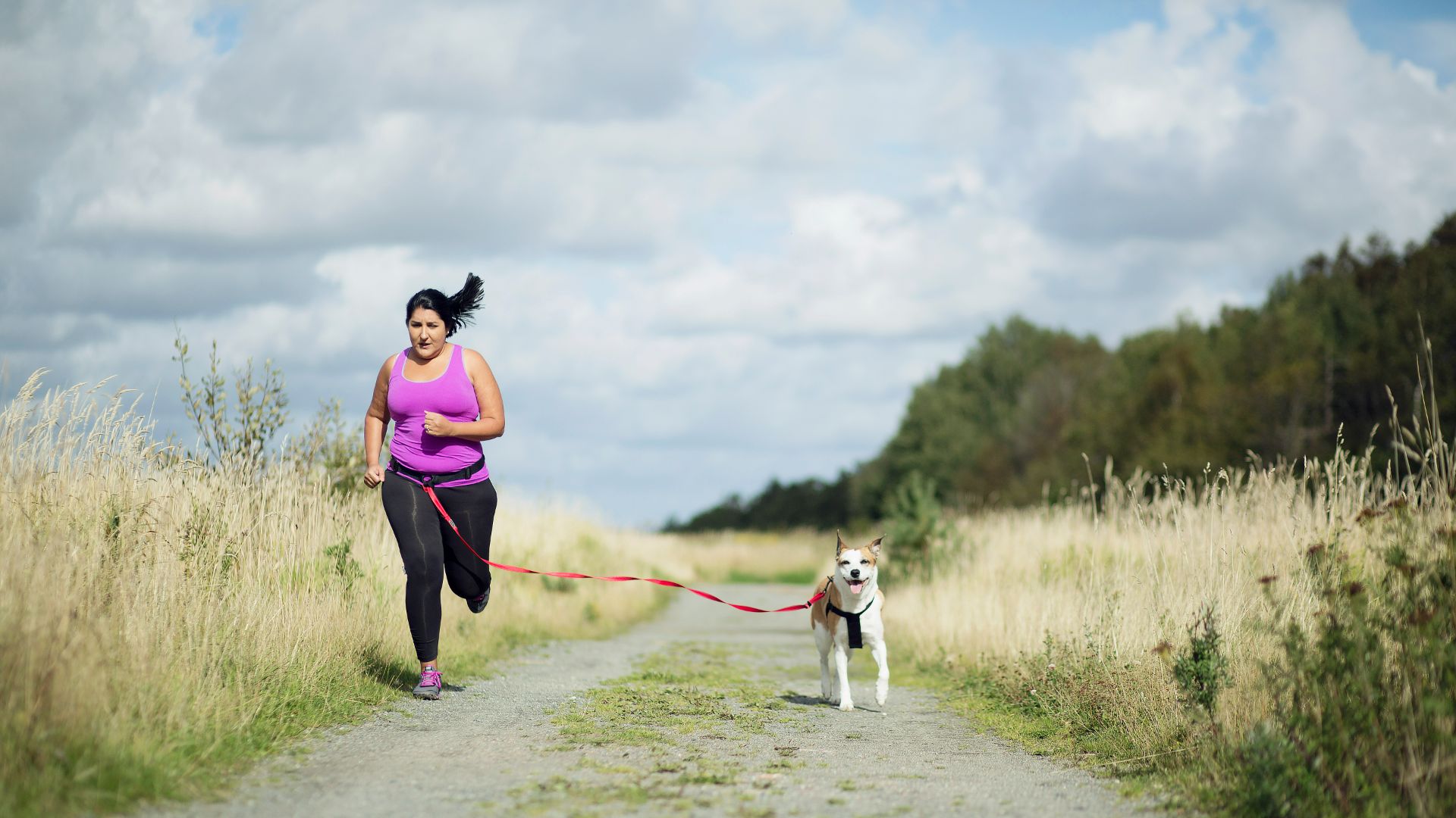 woman running with dog