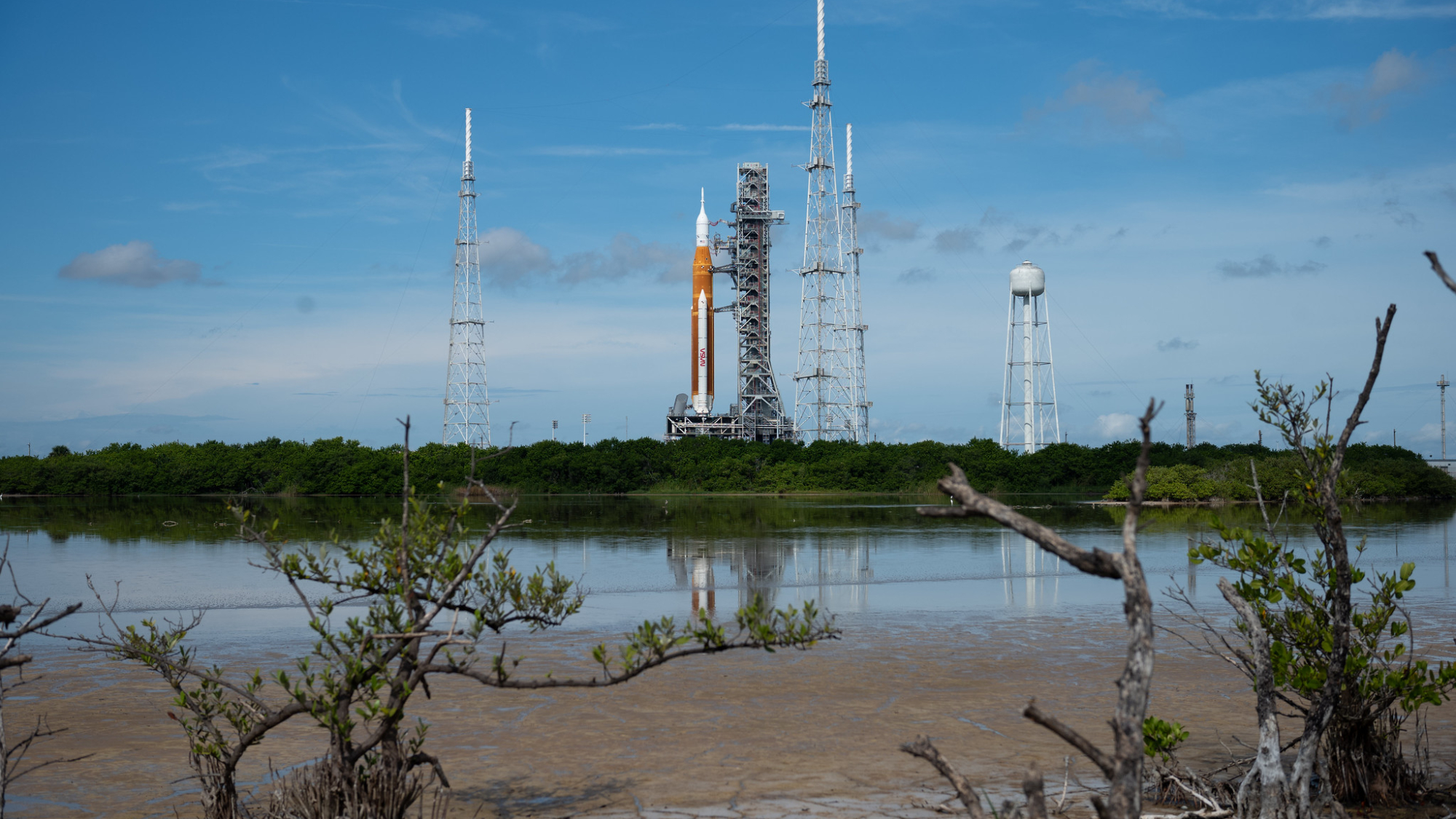 giant space launch system rocket on launch pad and blue sky