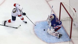 Igor Shesterkin #31 of the New York Rangers makes a save against Sam Reinhart #13 of the Florida Panthers during the third period in Game Five of the Eastern Conference Final of the 2024 Stanley Cup Playoffs