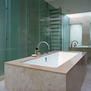 bathroom with opaque glass clad walls