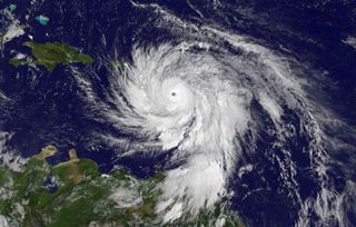 satellite view of hurricane against blue ocean