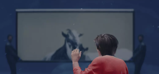 An animated version of Mark looks at a goat painting