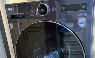LG 5.0 cu. ft. Mega Capacity Smart Front Load All-in-One Washer Dryer Combo close up to the control panel