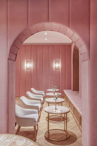Pink arch leading to seating