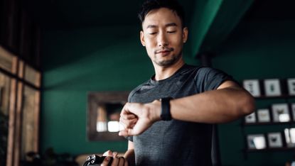 Man checking his fitness tracker after a workout