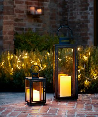 Malvern LED lanterns from Lights4Fun on a patio