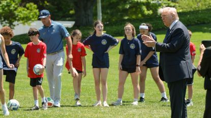 President Donald Trump speaks to kids after signing a proclamation to restore the Presidential Fitness Test.