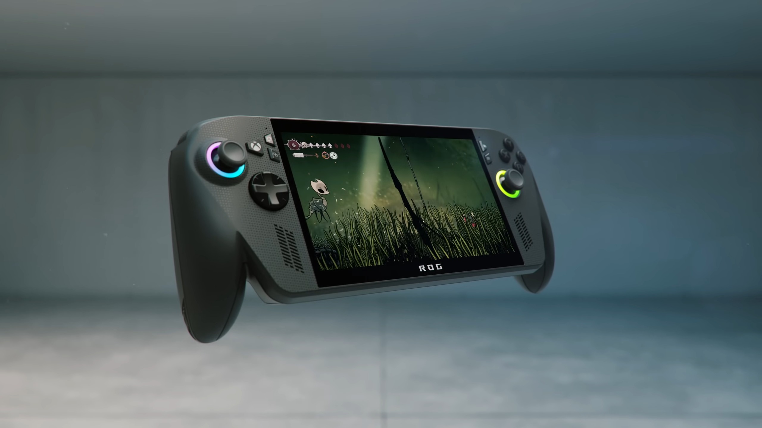 Hollow Knight: Silksong valley footage playing on floating ROG Xbox Ally