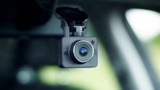 A dash camera inside a car windscreen