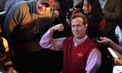 Rick Santorum poses for a picture while stumping in Iowa: The former senator's poll numbers are skyrocketing, but critics believe he'll fall back to Earth like so many other flavors of the mo