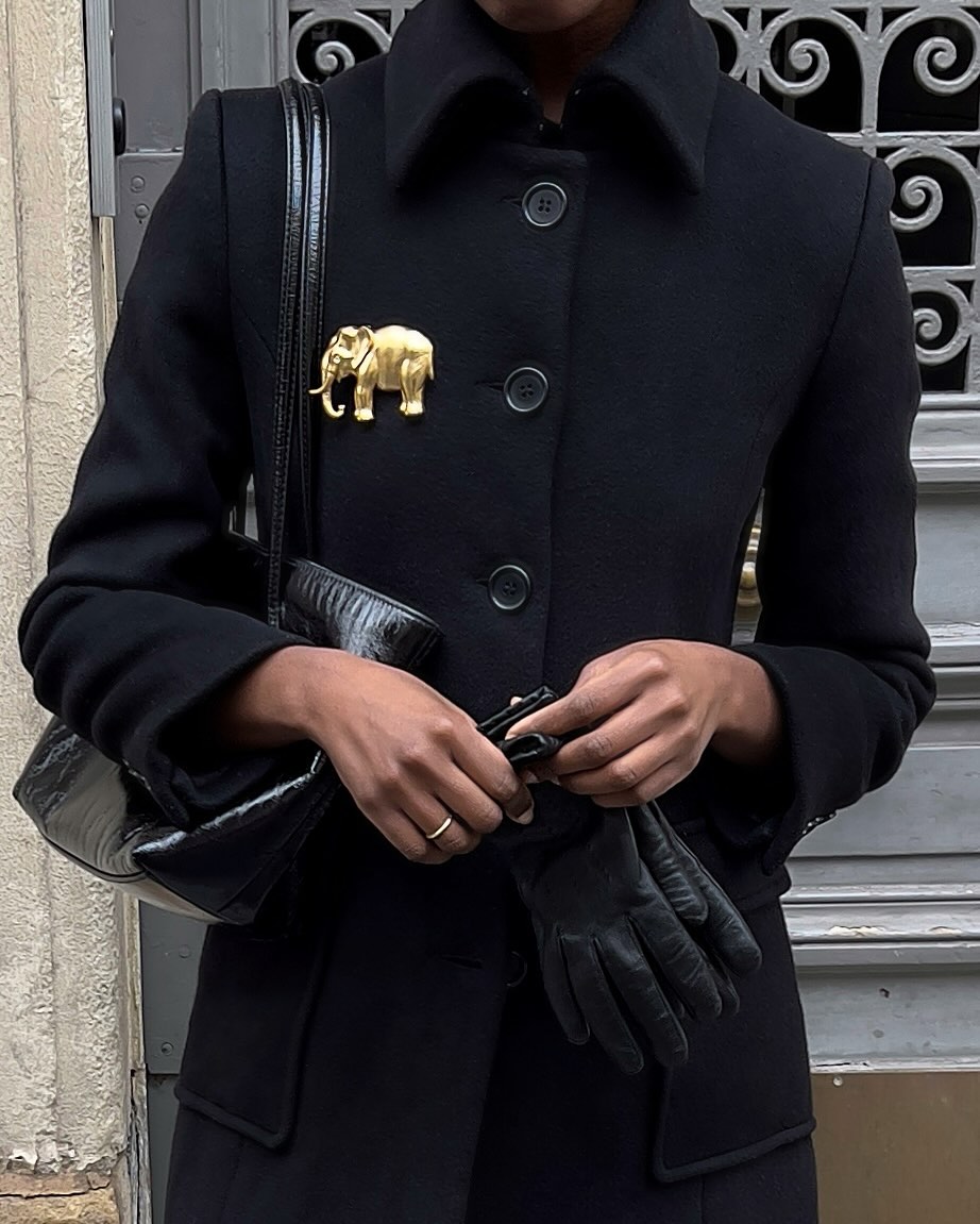 Sylvie Mus wears a gold brooch