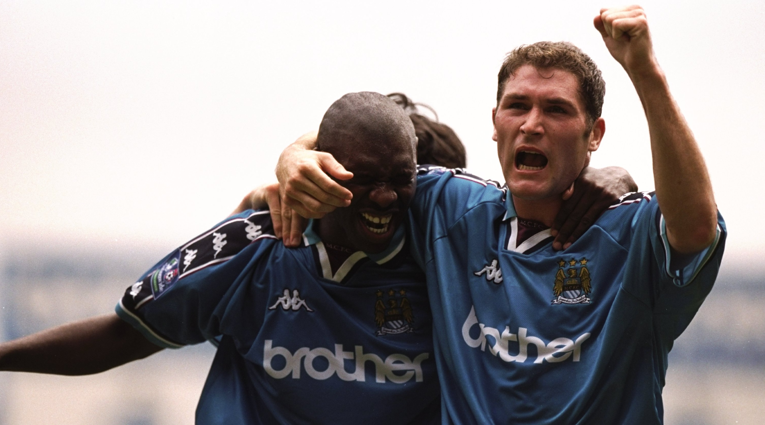 8 Aug 1998: Shaun Goater of Manchester City and team mate Lee Bradbury celebrate during the Nationwide Division One game against Blackpool at Maine Road in Manchester, England. City won 3-0.  Mandatory Credit: Ross Kinnaird /Allsport