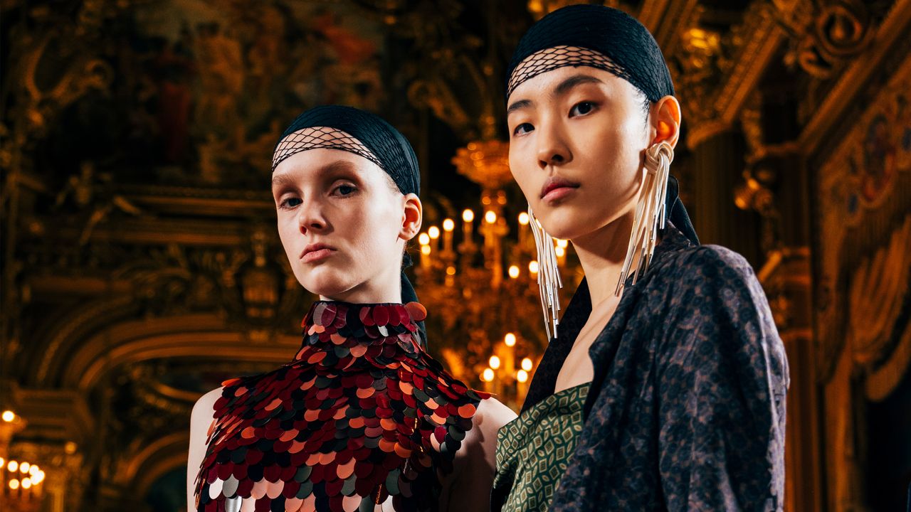 Two models photographed backstage at the Dries Van Noten F/W 25 show in Paris.