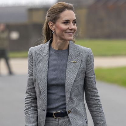 CONINGSBY, ENGLAND - OCTOBER 2: Catherine, Princess of Wales, Royal Honorary Air Commodore, visits RAF Coningsby in Lincolnshire during her first official engagement at the station, on October 2, 2025 in Coningsby, England. During the visit, Her Royal Highness learned about the station's operational role, met Quick Reaction Alert personnel, viewed a Typhoon aircraft, and toured the new Typhoon Future Synthetic Training facility, and also met families of personnel serving at the base. (Photo by James Glossop - WPA Pool/Getty Images)
