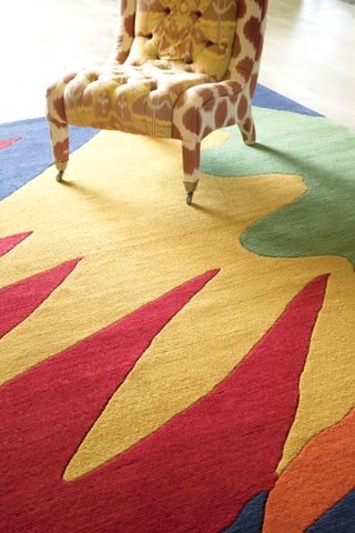colorful rug in yellow and red stripes