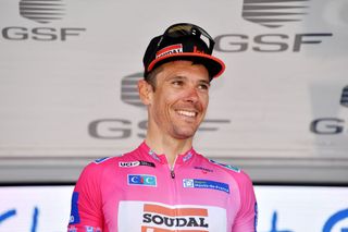 DUNKERQUE FRANCE MAY 08 Philippe Gilbert of Belgium and Team Lotto Soudal celebrates winning the Pink Leader Jersey on the podium ceremony after the 66th 4 Jours De Dunkerque Grand Prix Des Hauts De France 2022 Stage 6 a 1829km stage from Ardres to Dunkerque 4JDD on May 08 2022 in Dunkerque France Photo by Luc ClaessenGetty Images