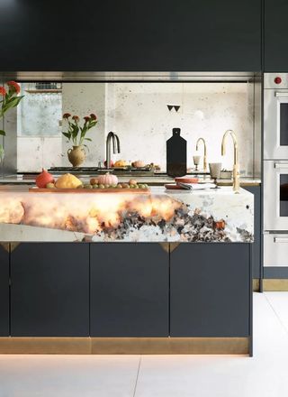 Modern kitchen with illuminated stone countertop, gray handleless cabinetry and mirrored backsplash