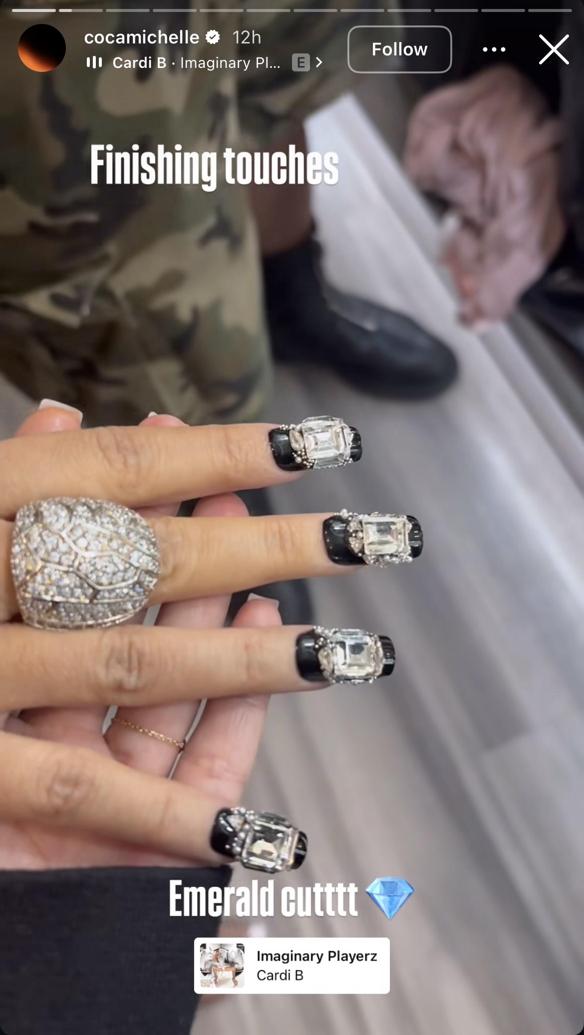 black nails with large rhinestones