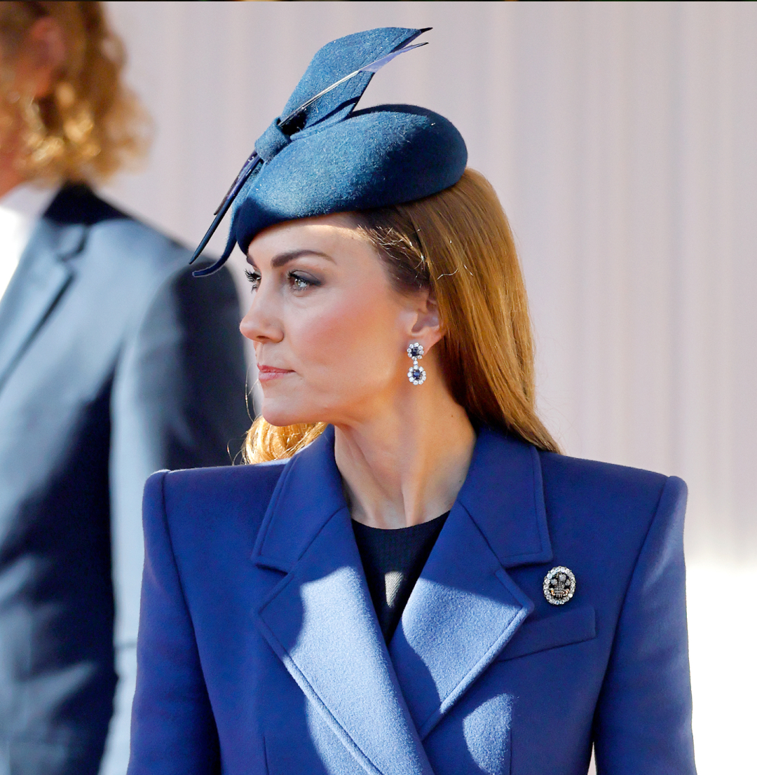 Kate Middleton wearing a blue coat and blue hat